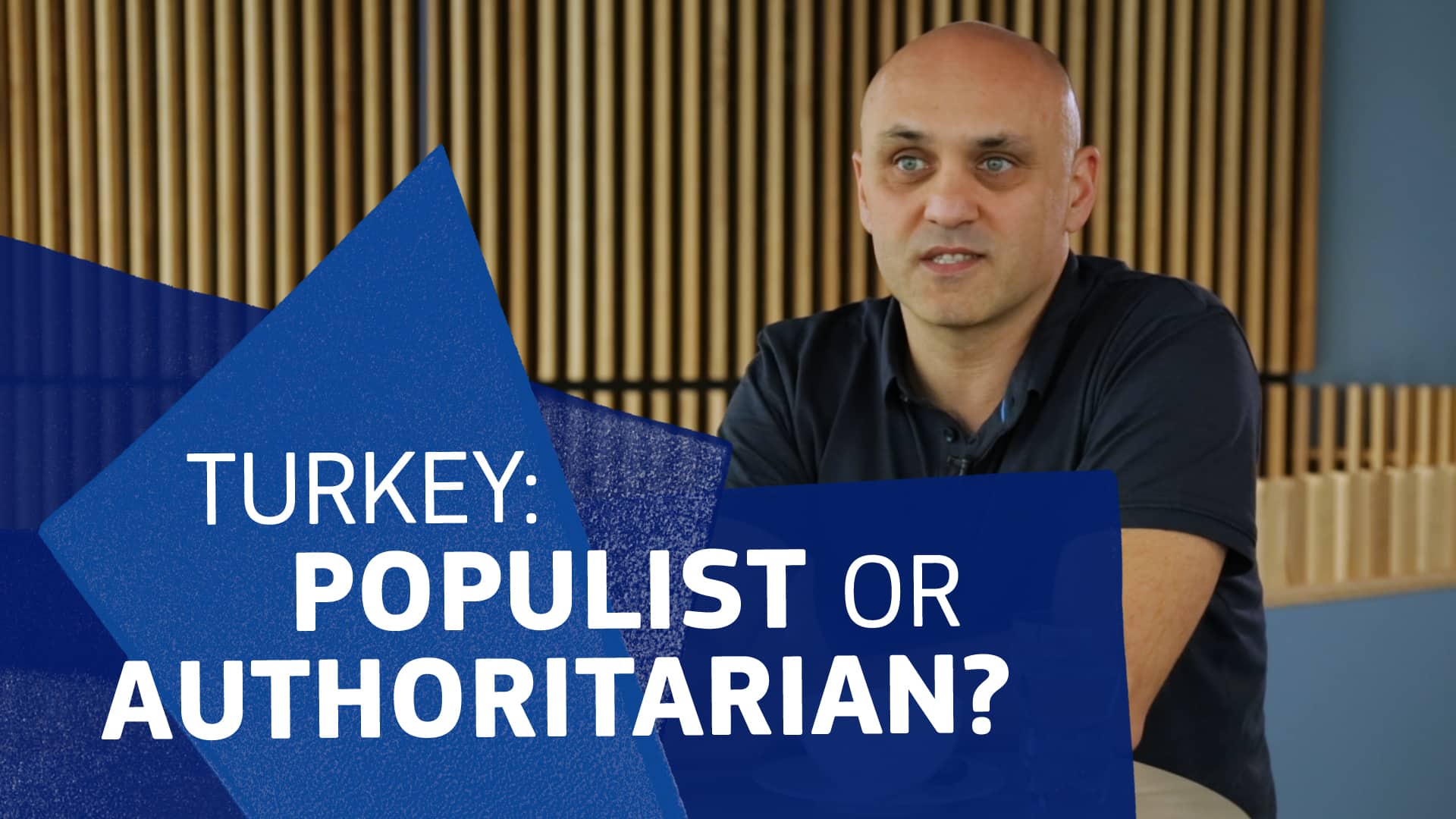 Ertuğ Tombuş speaking with text overlay 'Populist or Authoritarian?'